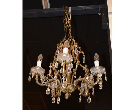 An ornate gilt metal ceiling light, with six branches, 58cm high x 52cm wide