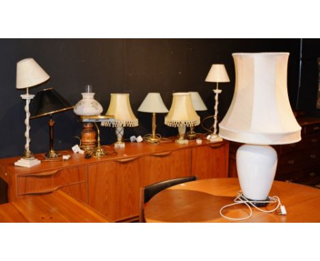 A quantity of table lamps, most with shades, to include a brass reading lamp