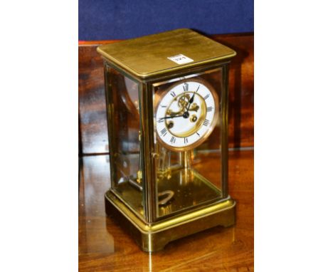 An early 20th century four glass mantle clock, with white enamel dial and mercury pendulum, 26cm high