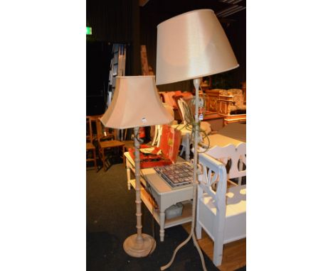 A painted wrought iron floor lamp, with shade 185cm high, with smaller example (2)