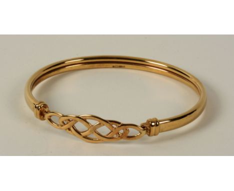 A 9ct gold bangle, with Celtic knot design clasp, 6.5g, 19cm circumference