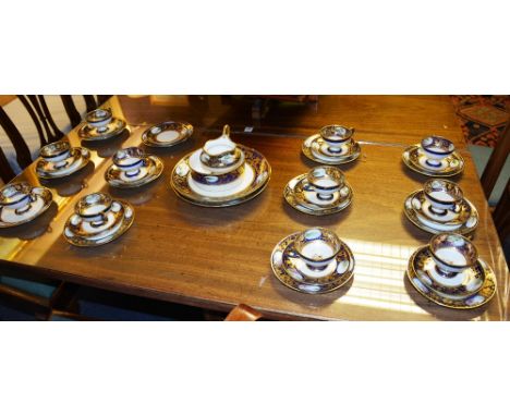 A Noritake china tea service, decorated with landscape panels on blue cobalt and gilt ground (35) CONDITION REPORT: Lot 1041 