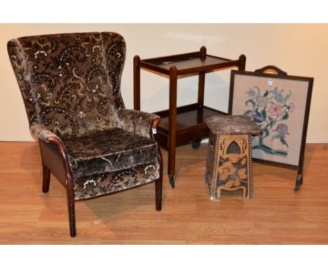 A vintage fireside armchair, 90cm high, together with tea trolley, firescreen and pokerwork occasional table (4)