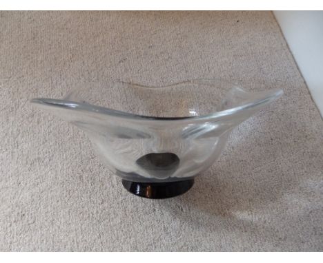 An Orrefors glass bowl with black foot, 7.5” diameter.