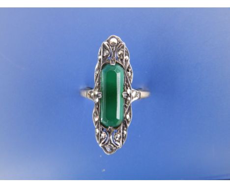 An art deco dress ring set with an elongated green 'stone' & marcasite in silver onto '9ct' yellow metal shank. Finger size R