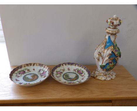 A continental porcelain cologne bottle – stopper re-stuck, 8.5” and a pair of Worcester style saucers. (3)