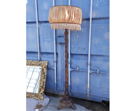 An Anglo-Indian carved wood standard lamp.