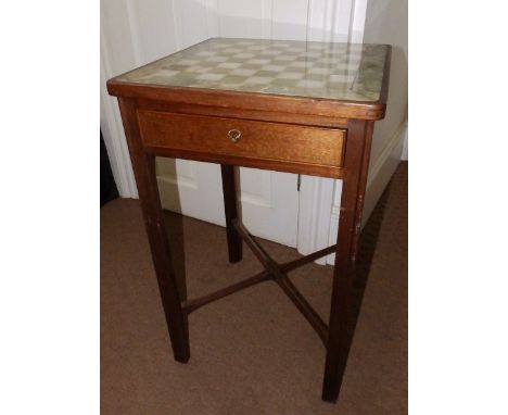 A square mahogany chess table in the Georgian taste, having green onyx top, two frieze drawers housing onyx chess pieces (two