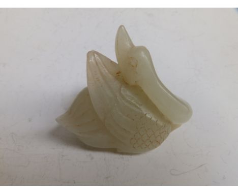A Chinese white jade carving of a bird. 2.5" across