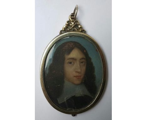 A 17thC  oval portrait miniature in oils on copper – bust length portrait of a young gentleman with long brown hair against a