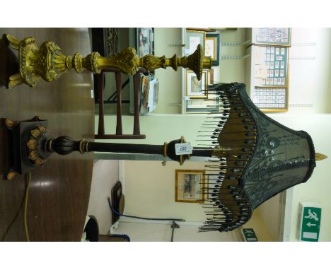 A modern bronze finished and gilded table lamp, having a reeded column, on a square base  22''h; and a moulded, gilded compos