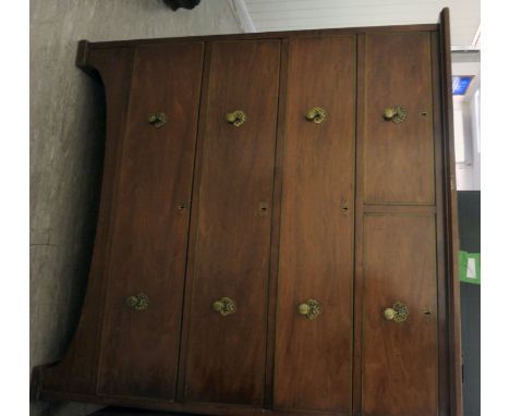 An early 20thC Continental walnut dressing chest, having an overhanging top and two short/three graduated long drawers with b