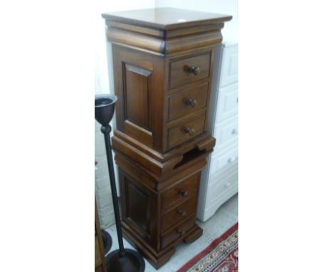 A pair of modern French style mahogany bedside cabinets, each having a frieze and three drawers, raised on a bracket plinth  