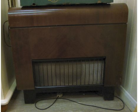 A 1951 Bush mahogany cased RG 11A radiogramme with a turntable, raised on black painted bracket feet  30''h  30.5''w with gua