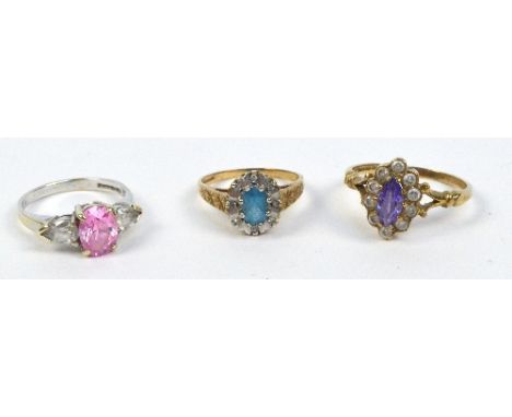 A 9ct white gold dress ring with an oval pink stone flanked by two pear shaped clear stones, size K/L, a 9ct yellow gold exam