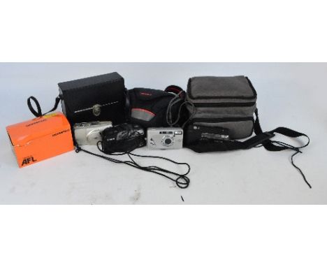 A quantity of camera equipment including a Minolta Dynax camera, another Minolta, two Canon, Olympus, camera cases etc plus a