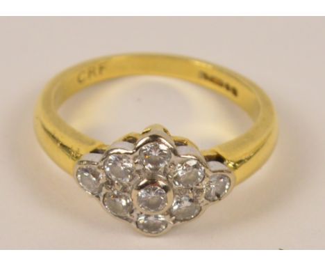 An 18ct yellow gold diamond ring with lozenge shaped platform set with nine diamonds, size K, approx 4.1g.