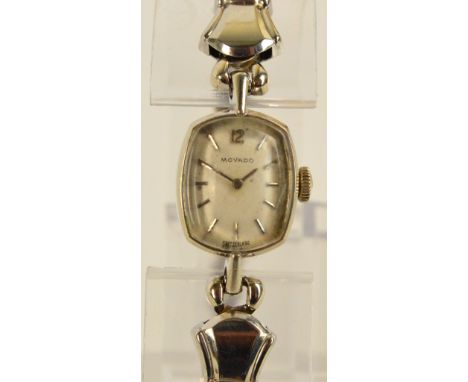 MOVADO; a vintage lady's cocktail manual wind wristwatch, the shaped rectangular dial set with baton numerals, the case stamp