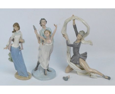 Three large Nao figures; a dancer with a swirling scarf, a ballet pas de deux (second) and a standing girl with shawl (second