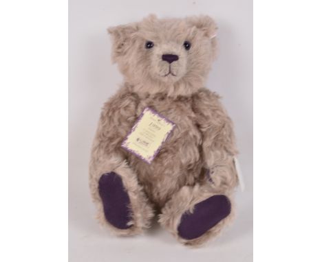 A boxed British Collectors' 1999 Steiff teddy bear no.660047, with numbered white and red tag to ear, with lilac curly mohair