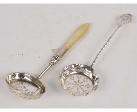 An Edwardian hallmarked silver sifting spoon with fluted rim to the bowl, twisted stem and pierced bright cut finial, John Mi