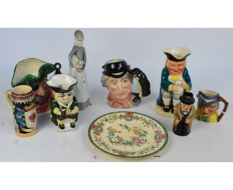 Two royal Doulton character jugs: D16616"Smuggler", and D6600 "The Walrus and Carpenter" and a small Royal Doulton toby jug o