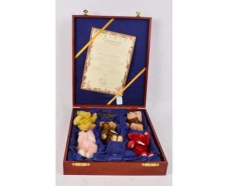 A boxed British Collectors' Steiff baby bear set 1994-1998, issued in 1999, no.654695, each bear a 16cm miniature of the orig