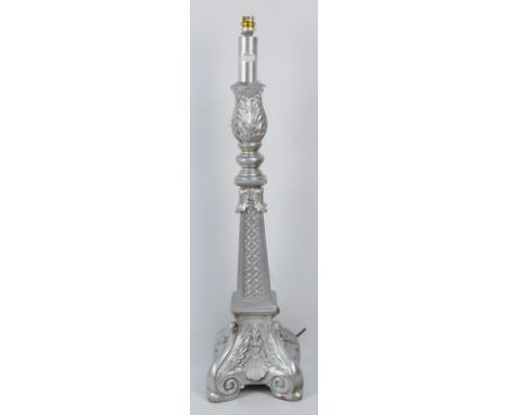 An ornate silvered table lamp, height 75cm.