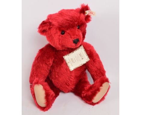 A boxed British Collectors' 1998 Steiff teddy bear no.659973, with numbered white and red tag to ear, with burgundy mohair fu