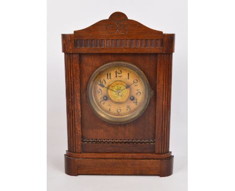 An early 20th century walnut and beech cased eight day mantel clock, height 34.5cm.