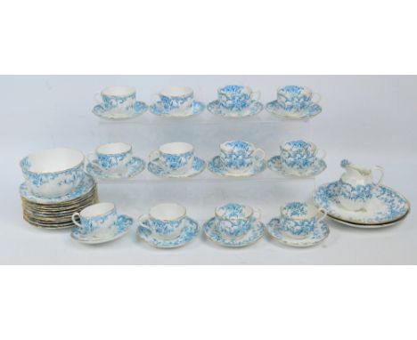 A Richmond dark turquoise blue and white twelve setting tea service decorated with flowers and scrolls, comprising jug and bo