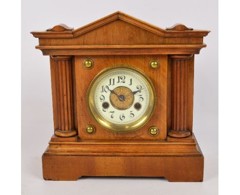 A late 19th century walnut cased 14 day striking mantel clock by Hamburg American Company, Wurttemburg, height 30cm.