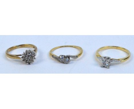 A 9ct yellow gold cluster ring set with small diamonds on a pierced gallery, size J, an 18ct yellow gold two stone crossover 