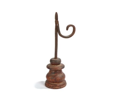                         A 19th century iron and wooden  table rush light holder, with tapering nips, square-section stem and 