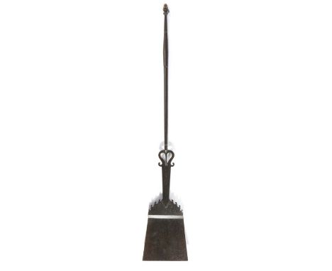                         A fine early 18th century wrought iron peel, with scrolled decoration,  the tapering stem with a styl