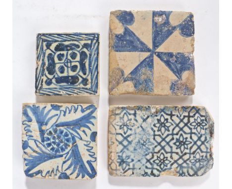                         Four  rare 15th/16th century blue and white tiles, Valencia, Spain, the first a  rose tile, 9cm wide,