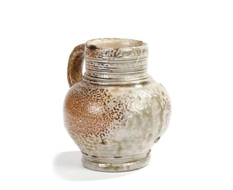                         A small 17th century stoneware pottery jug, the grey and brown speckled body with a ring decorated li