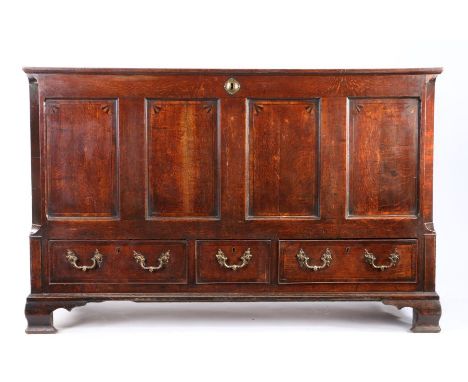                         A George III oak mule chest, circa 1780, the hinged top opening to reveal storage space, the quadrupl