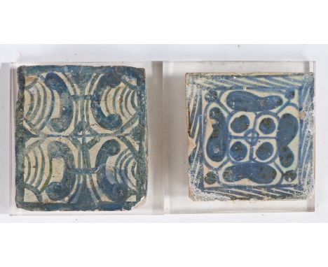                         Two 16th century tiles, the first a rose tile, Valencia, Spain, 9cm wide, the second of scroll design