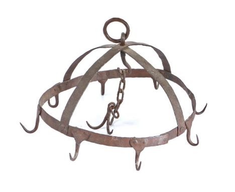                         A wrought iron game hanger, designed as a crown with eight hooks, centred by a chain with a further t