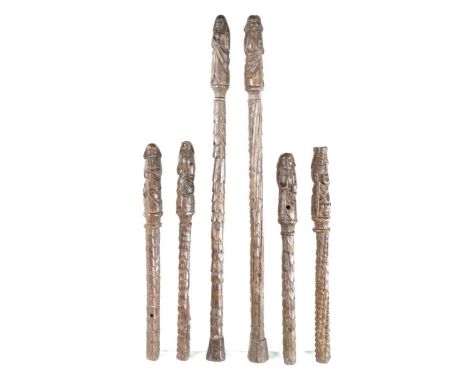                         A group of six early 16th century oak pilasters, circa 1500, each  topped with a carved apostle on sc