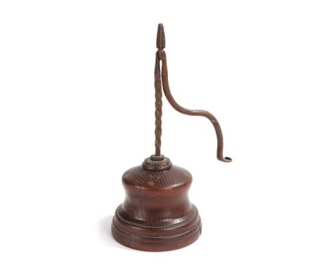                         A 19th century iron and oak/elm table rush light holder, the iron nips with twist stem and exaggerate