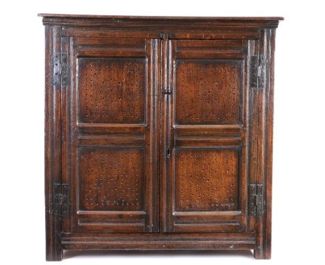                         A Charles I oak food hutch/cupboard, circa 1640, the rectangular top above a pair of doors, each with