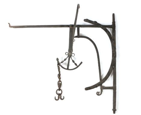                         An 18th century iron chimney crane, the corner bracket with an arched adjusting arm, the crane with t