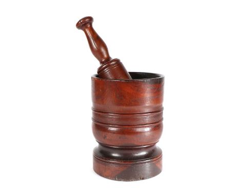 An early 18th century lignum vitae mortar, English, circa 1700-20
Of ring-turned cylindrical form, with waisted circular foot