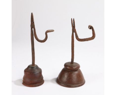                         A 19th century wrought iron and oak table rush light holder, of small proportions with iron hinged ni