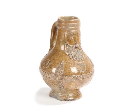                         A 16th century stoneware bellarmine, Frechen, Germany,  circa 1580, the  top lip and handle above a b