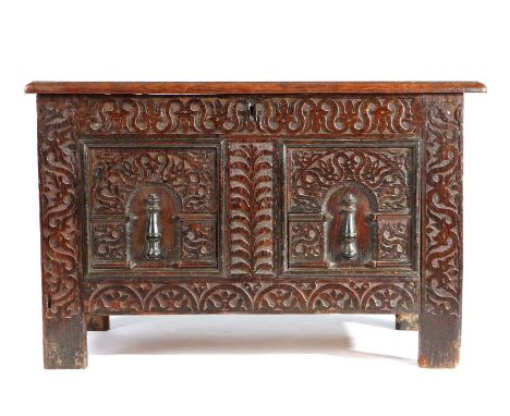                         An Elizabeth I oak coffer, West Country, circa 1600, with triple-panelled hinged top, the front with 