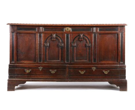                         An imposing Charles II oak chest with drawers, circa 1680,  the rectangular top with lappet-carved ed