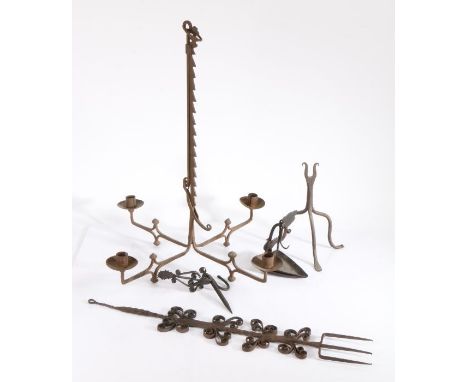                         A collection of domestic metalwork, to include an 18th century wrought iron rush light, a decorative 